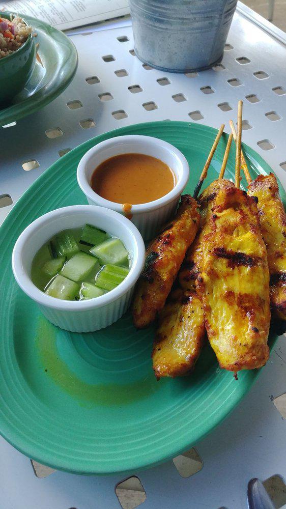 4 Piece Chicken Satay · Skewered chicken marinated and slow grilled, served with peanut sauce and cucumber relish sauce.