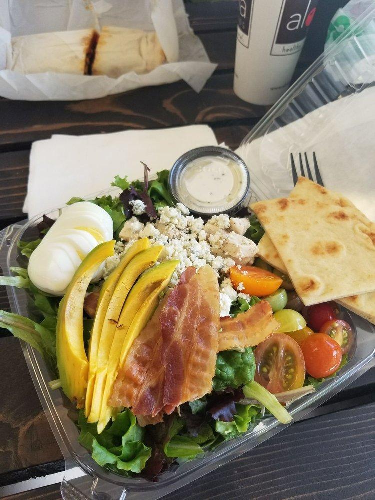 Kamuela Cobb Salad · Grape tomatoes hard boiled egg bacon avocado bleu cheese mixed field greens herb ranch dressing and grilled chicken breast.