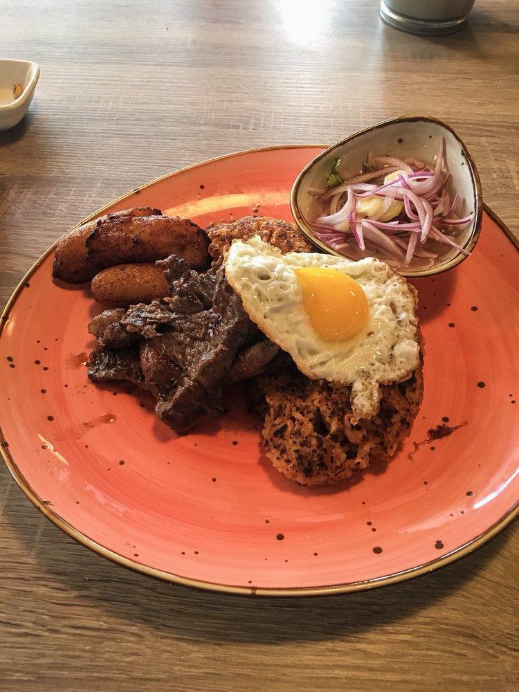 Tacu Tacu a Lo Pobre · Golden tacu tacu with 9 oz. of grilled flat meat steak, sweet plantains, fried egg and criolla sauce.