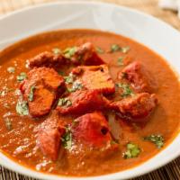 Chicken Curry · Home style chicken curry simmered with herbs and spices. Served with basmati rice and choice...