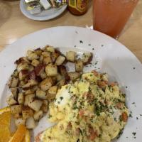 Smoked Salmon Scramble · Eggs scrambled with smoked salmon chives and cream cheese. Served with desiree potato hash a...