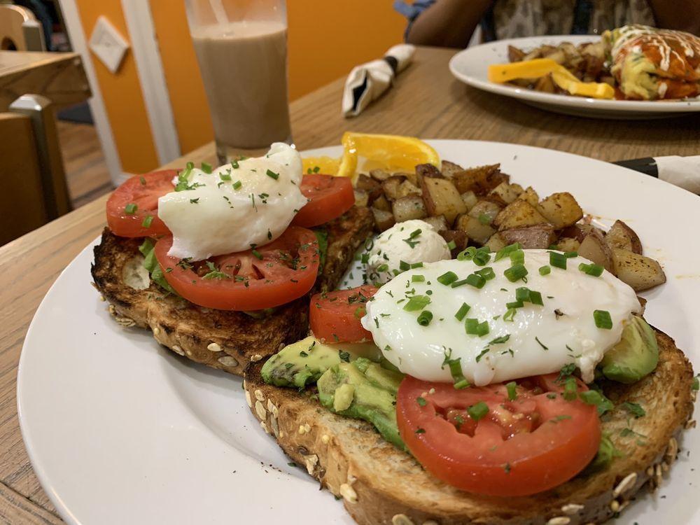 Avocado Toast · Choice of toast, avocado slices, tomatoes, poached eggs, goat cheese, sprinkled chives.