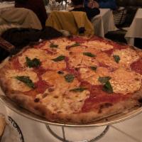 Small Margherita Pizza · Fresh mozzarella and basil.