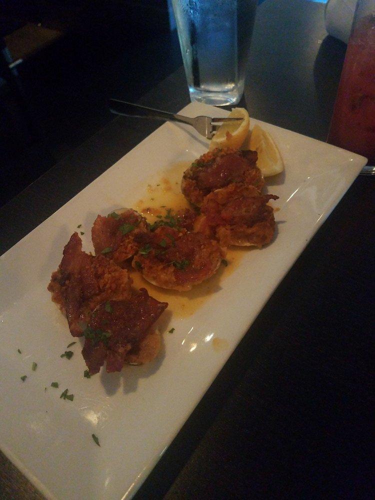 Clams Casino · Little neck clams topped with bacon and bread crumbs.