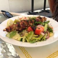 Agape House Greek Salad · Hearts of romaine lettuce, feta, tomatoes, cucumbers, red onions, and Kalamata olives. Tosse...