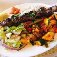 Lamb Tender · Cubes of marinated lamb, skewered and broiled. Served with seasoned vegetables and rice.