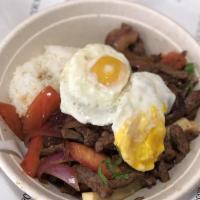 Lomo Saltado · Beef slices sauteed in onions, tomatoes, cilantro, french fries and soy sauce.  Served with ...
