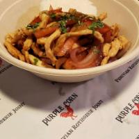 Pollo Saltado · Chicken slices sauteed in onions, tomatoes, cilantro, french fries and soy sauce served with...