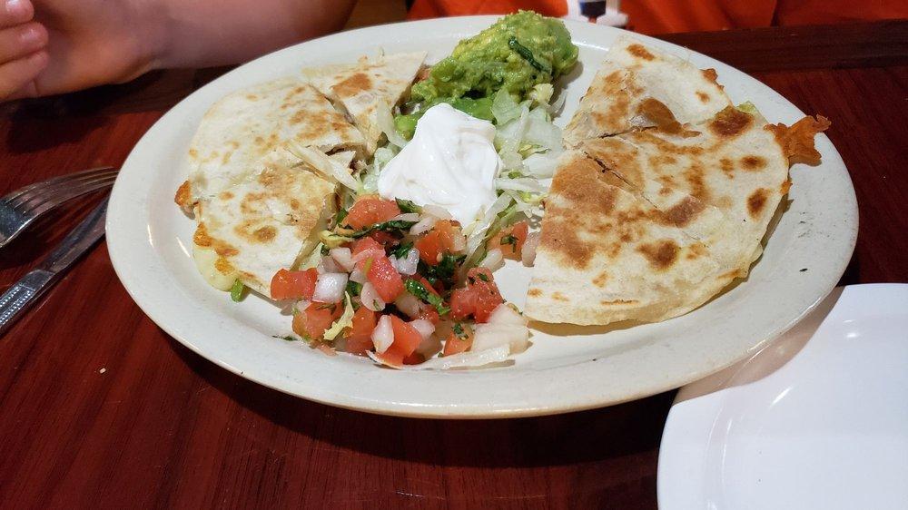 Quesadillas · Grilled, homemade flour tortillas stuffed with chicken, beef, or shrimp fajita and melted Monterrey Jack cheese, served with pico de gallo, guacamole, and sour cream.