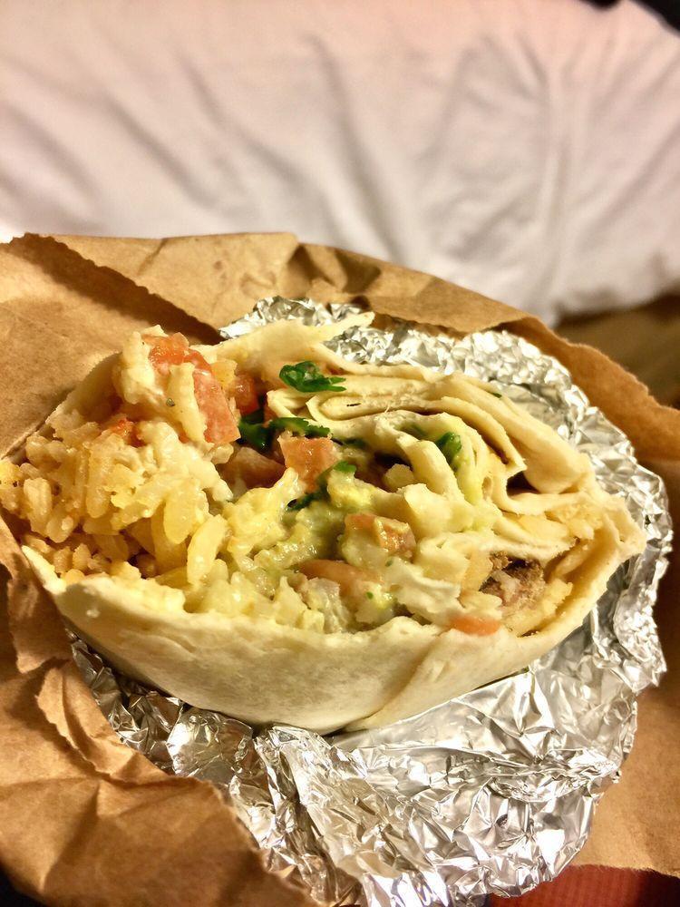 Super Burrito · Meat, beans, rice, fresh salsa, guacamole, sour cream and cheese.
