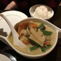 Green Curry · Green curry paste cooked in coconut milk with bamboo shoots, eggplants, string beans, bell p...