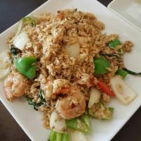 Shrimp Fried Rice · Stir-fried jasmine steamed rice with fresh shrimp, egg, onions, peas and carrots.