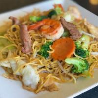 Chow Mein · Stir-fried egg noodles with chicken, broccoli, cabbage, celery, carrots and bean sprouts in ...