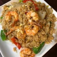 Spicy Fried Rice · Stir-fried jasmine steamed rice with egg, onions, bell peppers and basil leaves and chili wi...