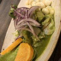 Cilantro Ceviche · Fish cuts marinated in a cilantro sauce, with fried calamari rings, 'choclo' and sweet potat...