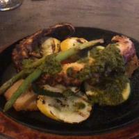 Grilled Octopus · Grilled octopus marinated with 'anticuchera' sauce, served with golden potatoes, zucchini, a...