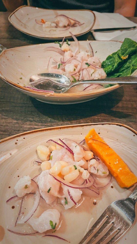 Classic Ceviche · Fish cuts marinated in lime juice, onion, cilantro, served with sweet potato and 'choclo'.