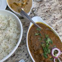 Lamb Rogan Josh · Boneless lamb cooked with a curry sauce of onions garlic, ginger, tomatoes and almonds. Curr...