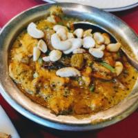 Butter Chicken · Boneless tandoori chicken cooked with cream, cashew nuts, onion, tomato and curry spices in ...