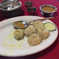 Chicken Momo · Ground chicken dumpling marinated with Nepalese spices and vegetables. Mildly spiced with gi...