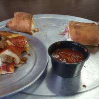 Stromboli · Ham, salami, mushroom and cheese rolled in pizza dough and served with tomato sauce. Add top...