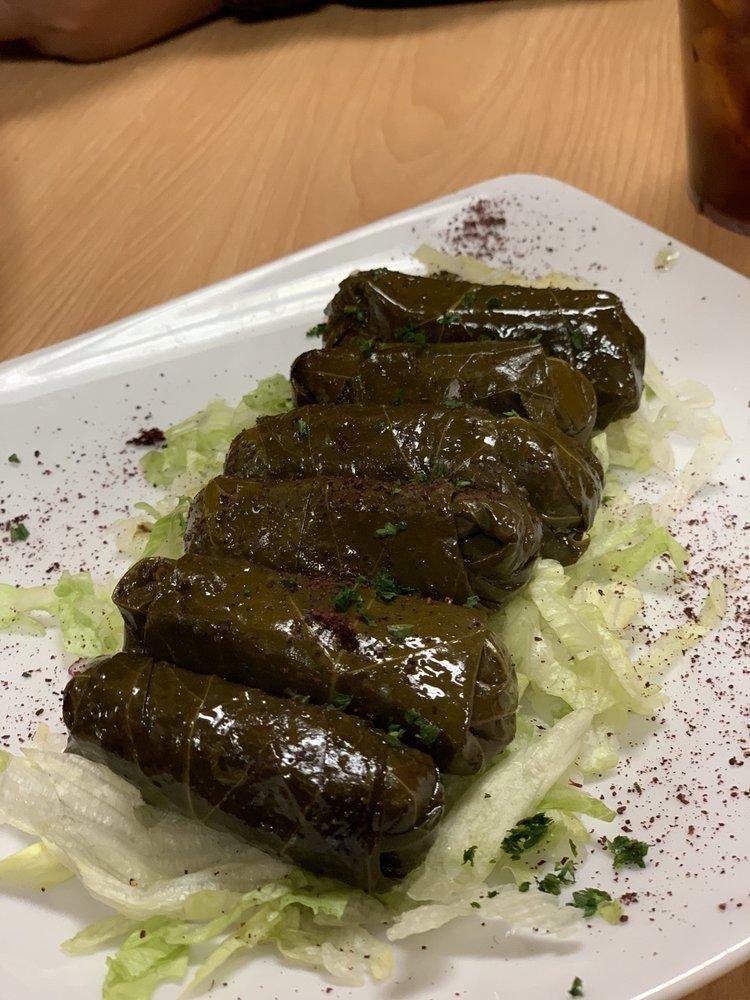 Dolmas · Grape leaves stuffed with rice, onion and a special blend of spices.