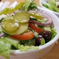 Greek Salad · A blend of fresh romaine lettuce, tomatoes, onions, cucumbers, and Kalamata olives topped wi...