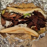 Gyro Sandwich · Ground lamb, beef, vegetables, and spices cut into strips with tzatziki sauce.
