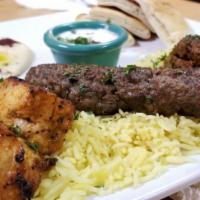 Mashawi Combo · A combination of beef kafta, chicken and lamb kabobs served with rice, hummus, our freshly b...