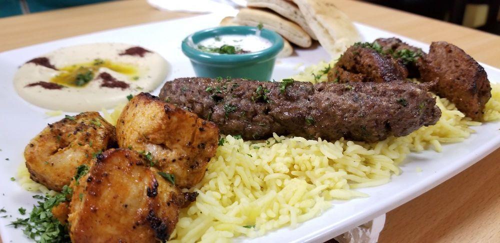Mashawi Combo · A combination of beef kafta, chicken and lamb kabobs served with rice, hummus, our freshly baked pita bread. Served with soup or salad.