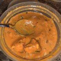 Chicken Tikka Masala · Creamy grilled chicken simmered in a velvety sauce with a subtle flavor.