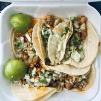 Tacos · Served with salsa, onions and cilantro.