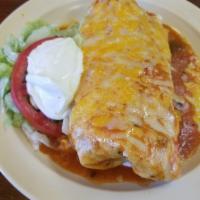 Wet Burrito · Served with beans, rice, sour cream, lettuce and tomatoes, choice of meat.