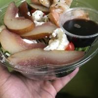Poached Pear Salad · Baby mixed greens, caramelized walnuts and poached Williams pears finished with Barolo wine ...