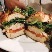 Dungeness Crab Sandwich · Dungeness crab meat, tomato, old bay aioli, pickled red onion and potato roll. Served with r...
