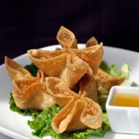 Crab Rangoon · Four pieces. Lite cream cheese and crab in crispy shell.