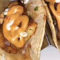 Fish Tacos · Three per order, Cajun tilapia with pico de gallo, sour cream, chipotle sauce