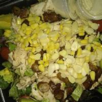 Shack Salad · Grilled chicken, avocado, dates, almonds, goat cheese, cherry tomatoes, and corn with champa...