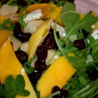 Mango Salad · Fresh and dried mango slices with dried cranberries and Parmesan cheese with balsamic vinaig...