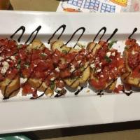Bruschetta · Diced tomatoes, basil and seasonings tossed in balsamic vinegar and olive oil. Topped with f...