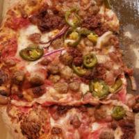 Mexican Pizza · Pinto beans, onions, jalapenos, sausage and chorizo. Includes extra cheese.