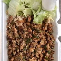 Chicken Over Rice · Grilled Chicken, Brown Rice, Salad topped with homemade Taziki sauce (White Sauce)