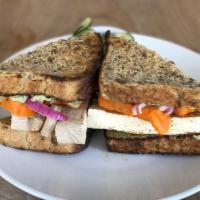 Nourish Banh Mi Sandwich · Marinated tofu (aminos, ACV, garlic, tamari, paprika), sweet potatoes, pickles, cilantro, ja...