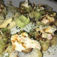 Cosimo Roll · Fried shrimp and cream cheese rolled uramaki style wrapped in avocado then tempura fried. To...