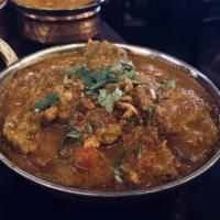 Goat Curry · Goat on the bone stewed in a hot and spicy gravy.