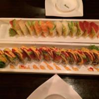 Perfect Rainbow Roll · 12 pieces. Spicy salmon, avocado, cucumber in soy paper, topped with assortment of fresh fis...