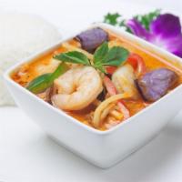 Red Curry · Bamboo shoot, red & green bell pepper, basil leaves and eggplant with coconut milk served wi...