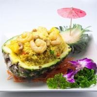 Pineapple Fried Rice · Steamed rice, Shrimp, chicken, pineapple, cashew nut, curry powder, pea-carrot, garlic and e...