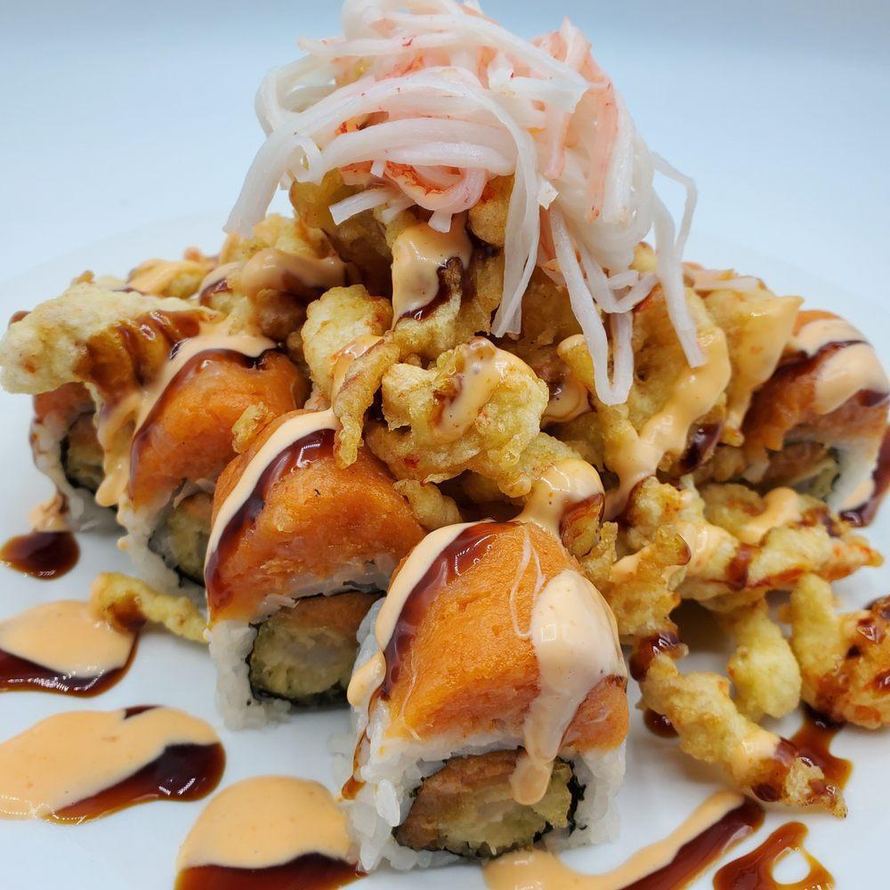 Vivid Roll · Spicy albacore and shrimp tempura inside. Spicy albacore, popcorn shrimp and ozaki crab outside.