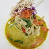 Green Curry · Thai green curry paste with bamboo shoots, eggplant and basil in coconut milk. Spicy.